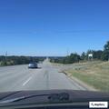 Car bumper blocking westbound lanes on OK-117