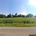 Woman walking in road near Dyersburg Highway