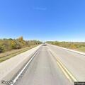 Loose rocks falling from gravel truck on highway