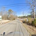 Stranded driver with flat tire blocking roadway