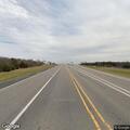 Car and semi crash with injuries at highway intersection