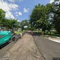 Loose water main cover causing road hazard