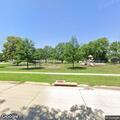 Caller reports vehicle plugged into park EV outlet near Jackson