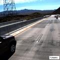 Traffic stop on bridge involving gray Chevy