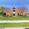 Person experiencing chest pain at church bus stop
