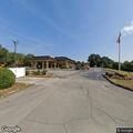 Woman with dizziness and high blood pressure at motel