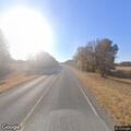 Red pickup driving erratically on Highway 82