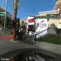 Man smoking crack at bus stop near Paris hotel