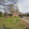 Vehicle overturns into house on Williston Road