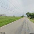 Abandoned damaged sedan blocking road in Catoosa