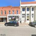 Person blocked in by parked vehicle at business