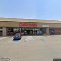 Dog in distress inside parked car at supermarket