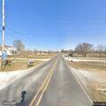 Traffic stop on green sedan at Elm Springs road