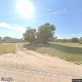 Motorcycle and tractor crash with injuries on County Road
