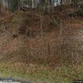 Patrol vehicle slides off road into embankment