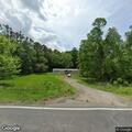 Brush fire spreading near house on Dennis Road