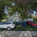 Tree limb on power line sparks near house