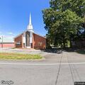 Man chases woman with pitchfork near church
