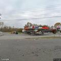 Officer checks unoccupied car at gas station