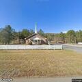 Person experiencing chest discomfort at church