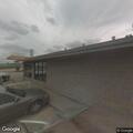 Man at gas station hitting his own face in distress
