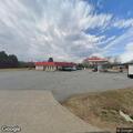 Person very ill in vehicle at Three Points Grocery