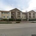 Female injured with knee pain at senior apartments