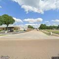 Woman with nausea and high blood pressure at industrial park