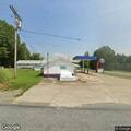 Man slumped over in pickup truck at service center