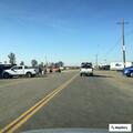 Debris from box truck damages car on Highway 99