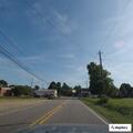 Female yelling inside vehicle near dumpster at store