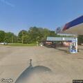 Welfare check for elderly woman carrying bags near store