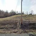 Motorcycle crash with injured woman in roadside ditch