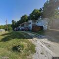 Dog trapped under car engine at Blue Eye home
