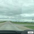 Loose panel on semi trailer on Highway 69