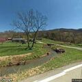 Vehicle reportedly in creek on Mulberry Gap Road
