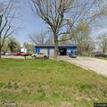 Officer checks alarm at auto service shop