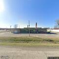 Suspicious person at storage units behind hardware store