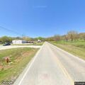 Suspicious man near business sign on Highway 85A