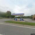Man experiencing chest pain by car on highway