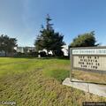Person in wheelchair with leg infection at library