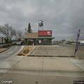 Traffic stop on red Kia sedan at Jack in the Box