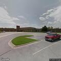 Woman falls and hits head near white SUV in parking lot