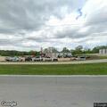 Mower throws debris, damaging passing car
