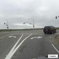 Dark red sedan hits center divider on Highway 101