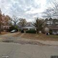 Officer serving papers near Davis Street