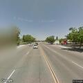 Dump truck spilling dirt and sand on highway