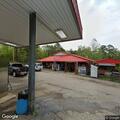 Abandoned damaged Jeep left at Hilltop Grocery