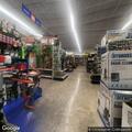 People looking in windows behind Harbor Freight