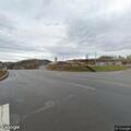 Car with flat tire creating traffic hazard